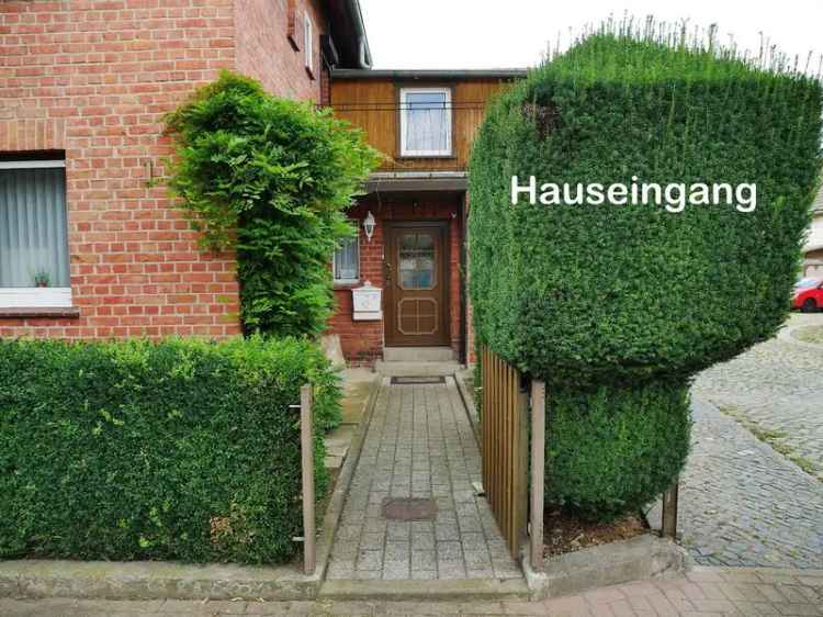 Wohnhaus mit Werkstattgebäude, Garage und Garten