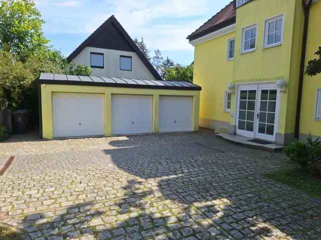 Toplage! Feine Erdgeschosswohnung mit Südterrasse & -garten, Kamin & Pkw-Stellplatz