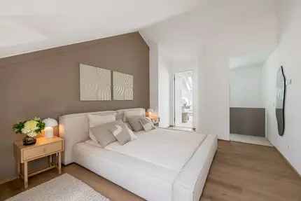 Neubau: Modernes Mittelhaus mit Seeblick und smarten Features