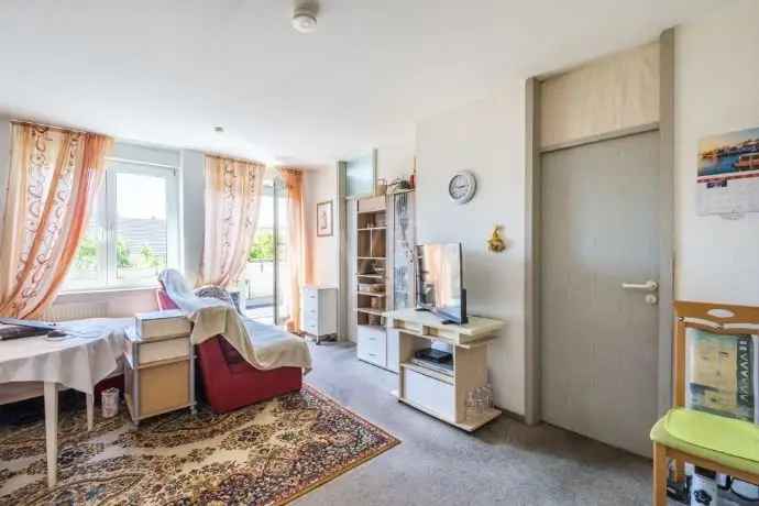 Karlsruher 2-Zimmer-Wohnung mit Dachterrasse und Tiefgarage