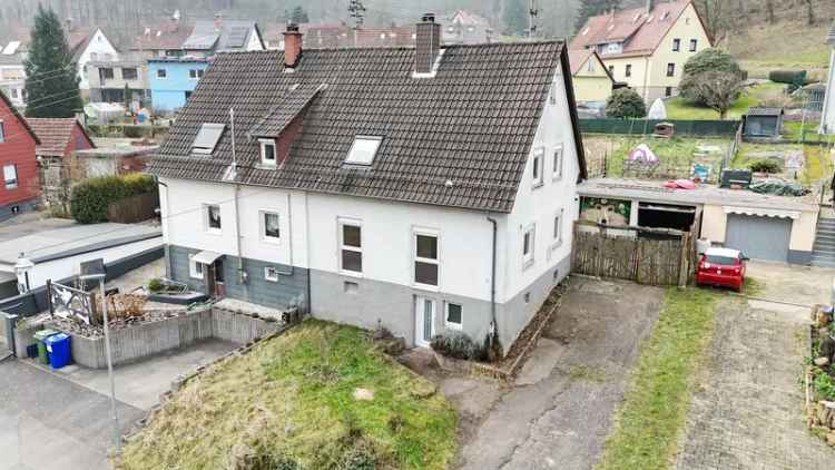 Doppelhaushälfte mit Garten und Garage Renovierungsobjekt