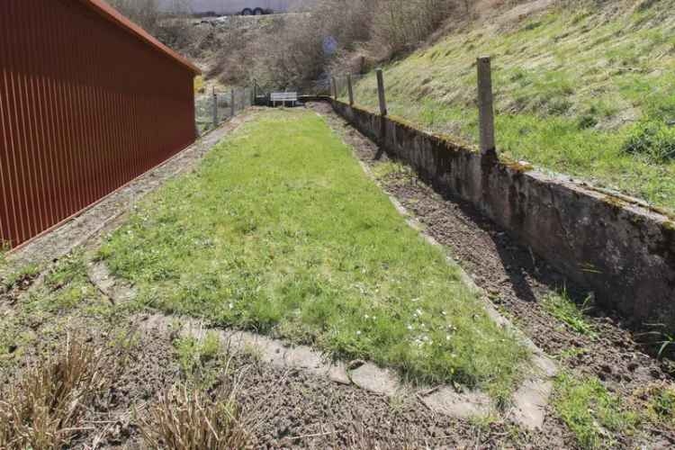 Reihenmittelhaus mit großer Wohnfläche, Garten und charmantem Preis